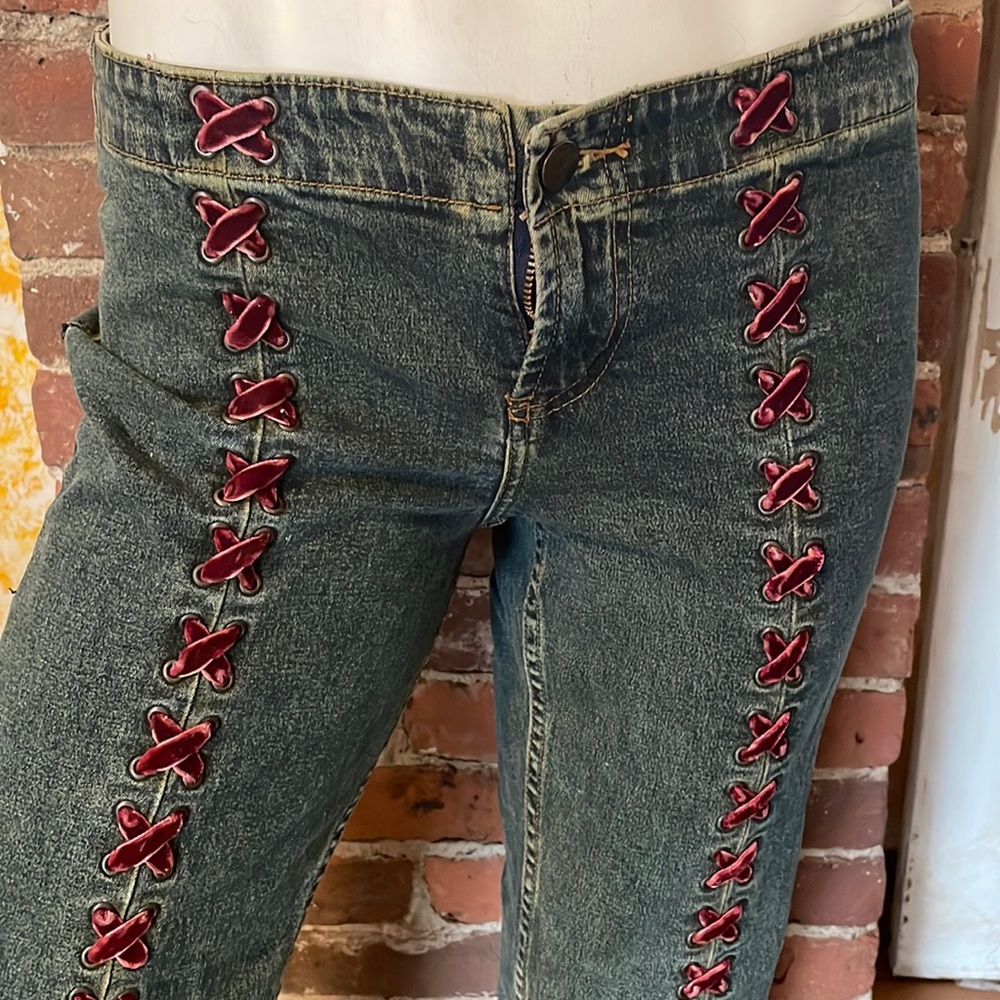 L.E.IGORGEOUS VINTAGE WASH JEANS WITH MAROON VELVET CORSER STYLE LACE UP TIES.